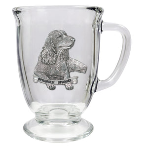 Clear glass mug with a silver Springer Spaniel emblem on a white background