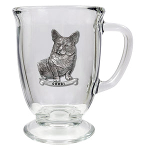 Clear coffee mug with metal corgi emblem on a white background